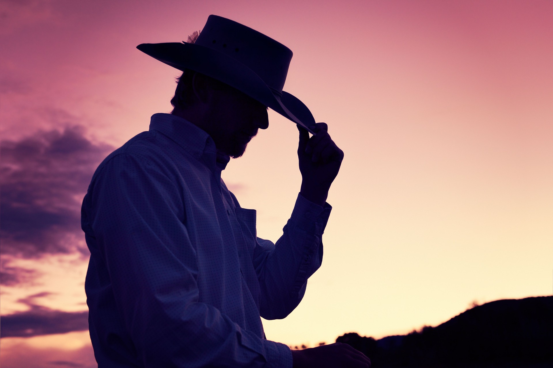 Gentleman Cowboy Tipping His Hat In A Western Sunset